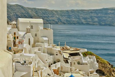 High angle view of buildings against sea