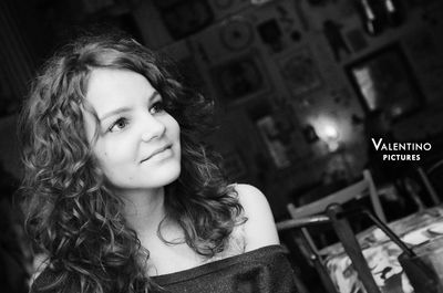 Close-up portrait of a smiling young woman