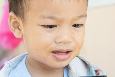 Close-up of boy crying outdoors