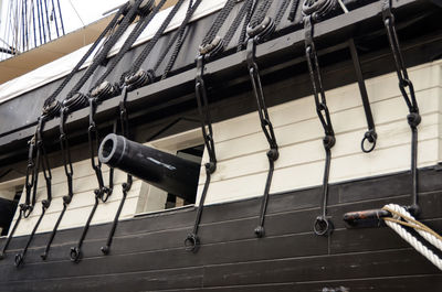 Low angle view of rope hanging on building