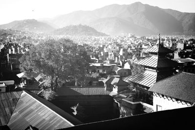 Cityscape with mountain range in background