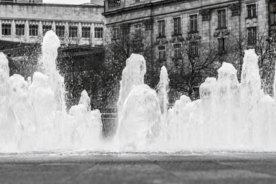 Water splashing on fountain in city