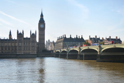 Bridge over river with buildings in background