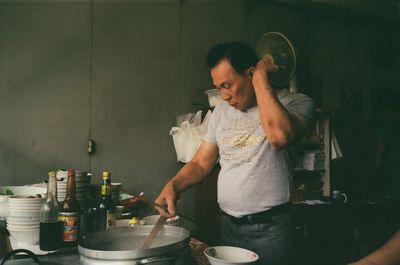 Man preparing food in kitchen