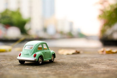 Close-up of toy car on road