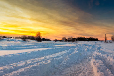 Scenic view of landscape against sky during winter