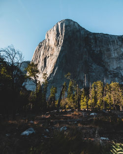 Low angle view of rock formation against sky