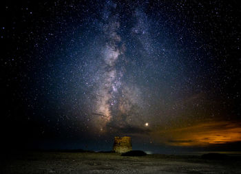 Scenic view of sea against sky at night