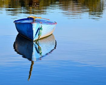 Boat moored in lake