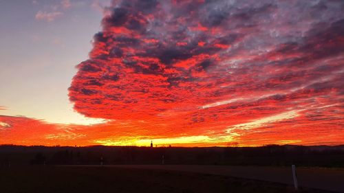 Scenic view of dramatic sky during sunset