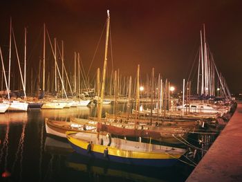 Boats moored at harbor