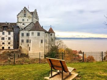 View of old building against cloudy sky