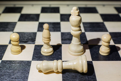 Close-up of chess pieces on table