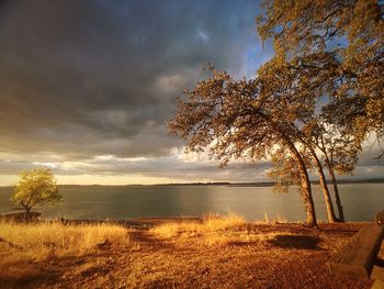 View of calm countryside lake against the sky