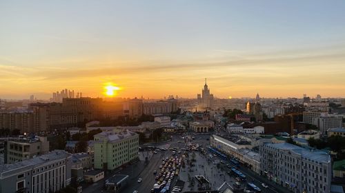 High angle view of city buildings during sunset