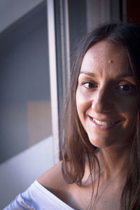 Close-up portrait of smiling woman