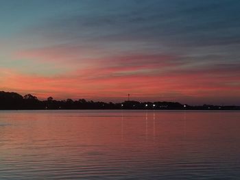 Scenic view of sea against romantic sky at sunset