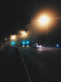 Cars on street at night