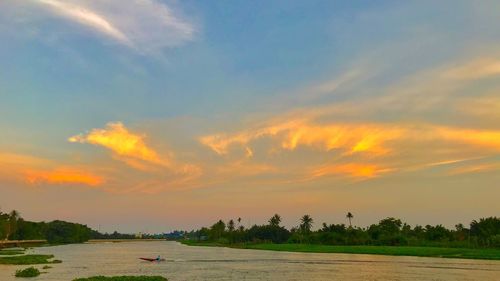 Scenic view of land against sky during sunset