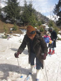 Full length of man with umbrella on snow