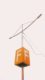 Low angle view of road sign against sky