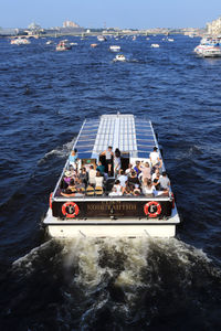 High angle view of people on boat in sea