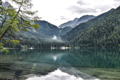 Scenic view of lake and mountains against sky