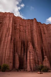 Low angle view of rock formations against sky