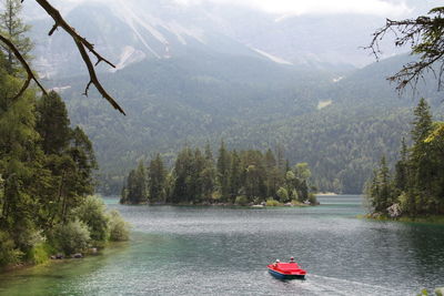 Scenic view of river against mountains