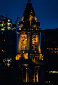 Illuminated buildings in city at night