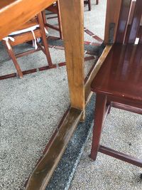 High angle view of empty chairs and table in cafe