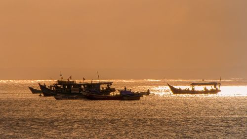 Scenic view of sea against clear sky during sunset