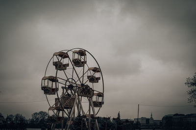Low angle view of ferris wheel against sky