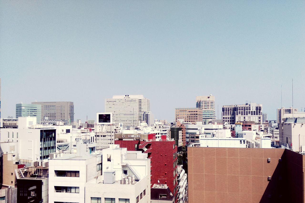 building exterior, architecture, built structure, clear sky, copy space, residential building, residential structure, house, city, building, roof, day, residential district, outdoors, low angle view, development, no people, sky, construction site, sunlight