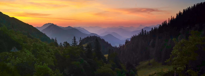 Panoramic view of mountains against sky during sunset