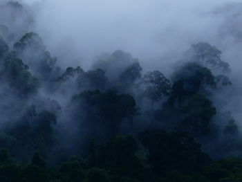 Scenic view of mountains against cloudy sky