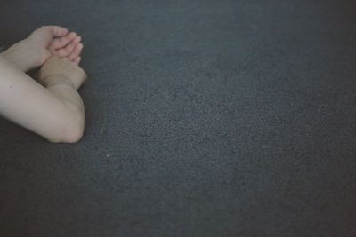 Low section of man relaxing on floor