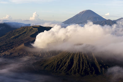 View of volcanic landscape against cloudy sky