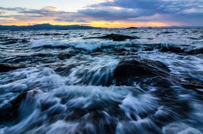 Scenic view of sea at sunset