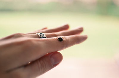 Close-up of woman hand on finger