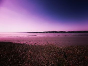 Scenic view of beach against clear sky