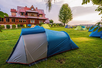 Tent in field against sky