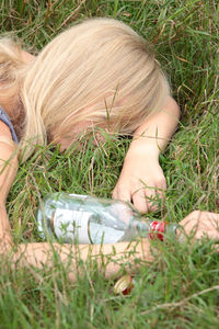Midsection of woman on grass in field