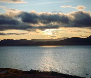 Scenic view of lake against sky during sunset