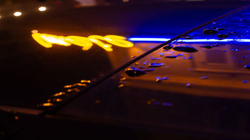 Close-up of yellow lights at night
