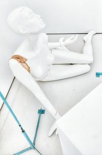 High angle view of broken mannequin on floor