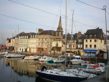 Boats moored at harbor