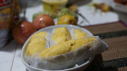 Close-up of durian in plate on table 