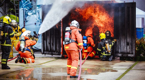 Figters against fire in container