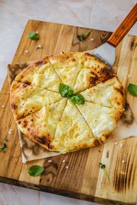 Close-up of pizza on cutting board